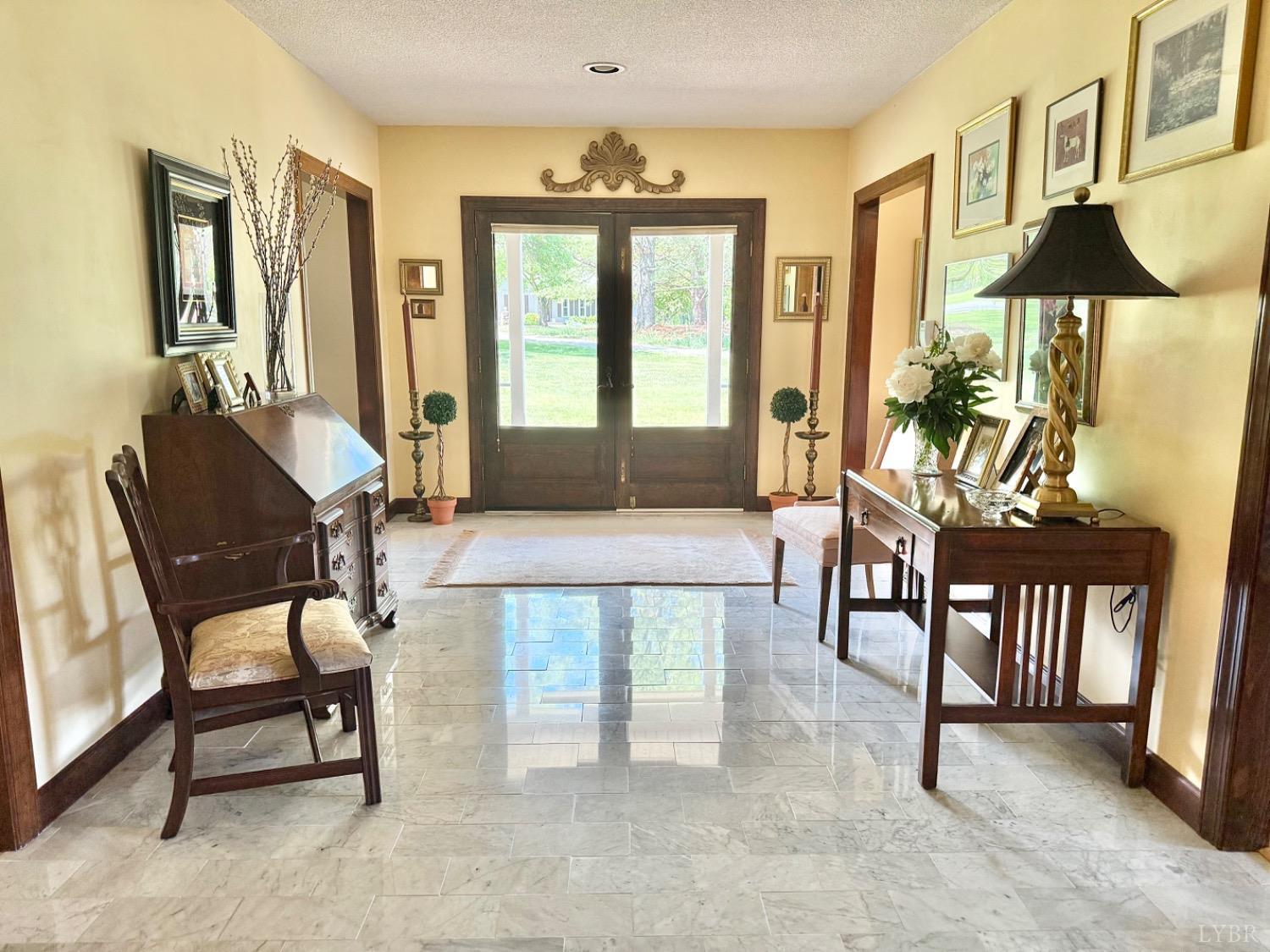 306 Quail Meadows Drive Forest, VA 24551 - Photo 10 of 57 a living room with furniture and a chandelier