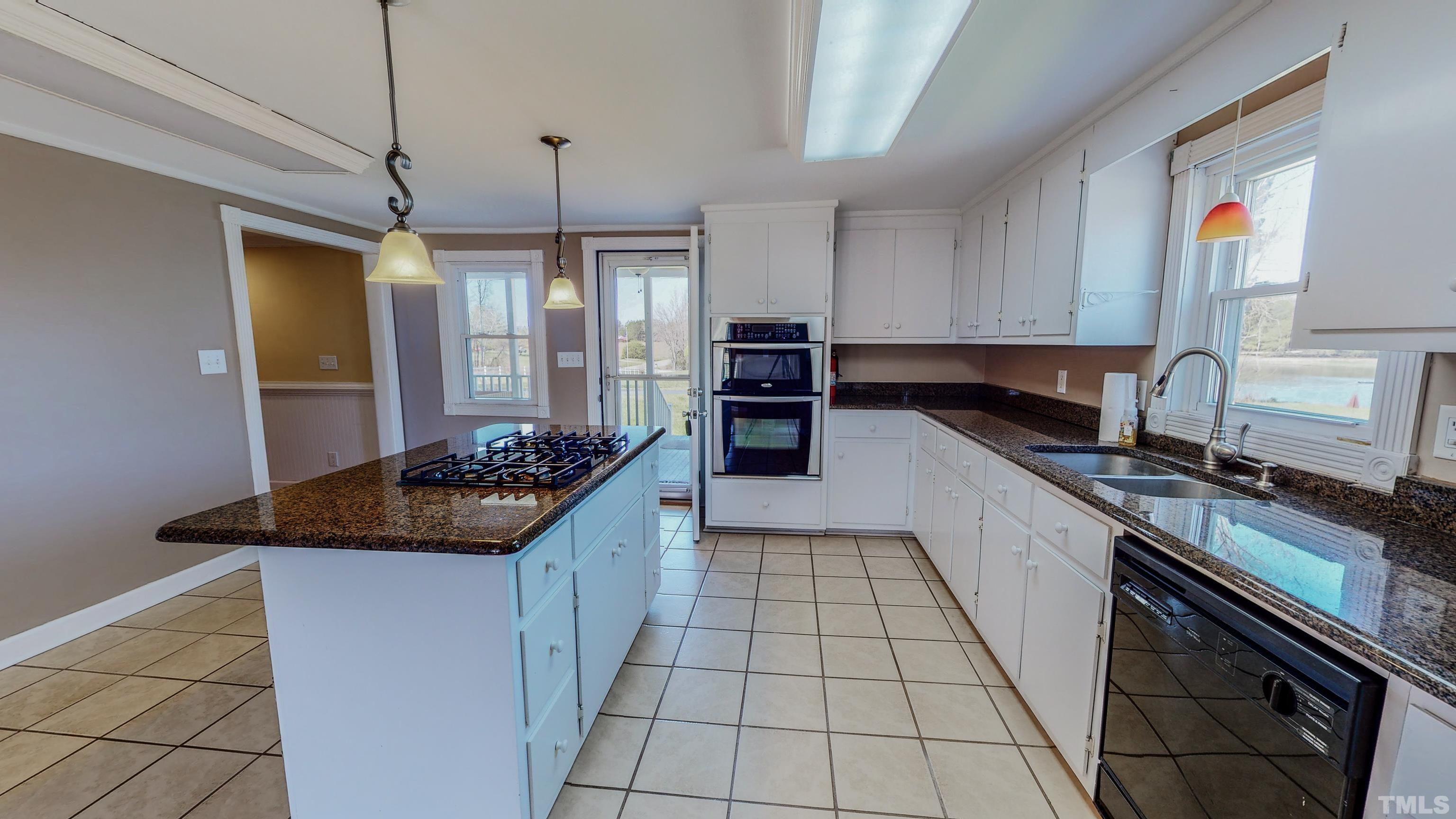 7435 Helena Moriah Road Rougemont, NC 27572 - Photo 13 of 58 a kitchen with a sink and a stove top oven