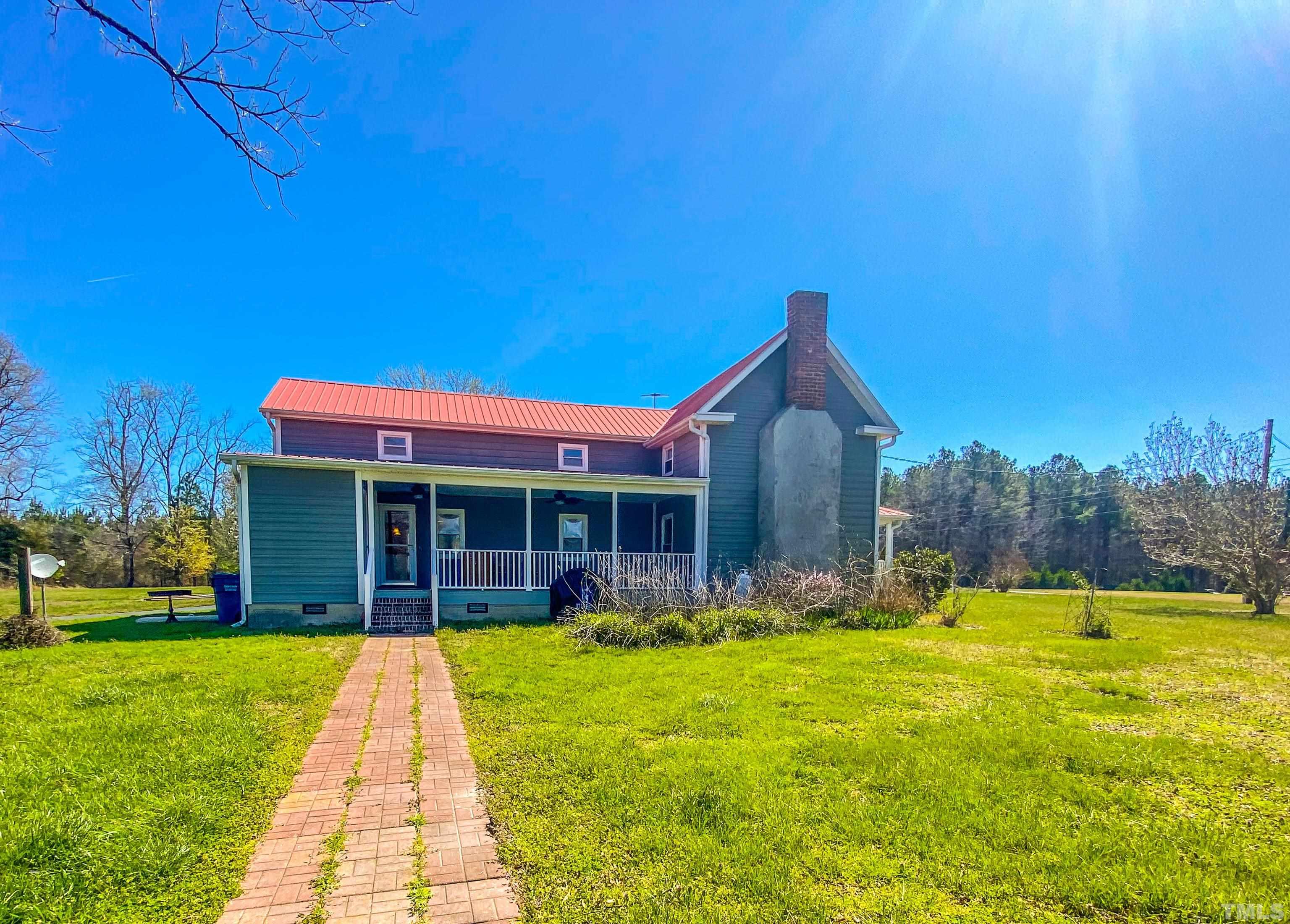7435 Helena Moriah Road Rougemont, NC 27572 - Photo 23 of 58 front view of a house with a yard