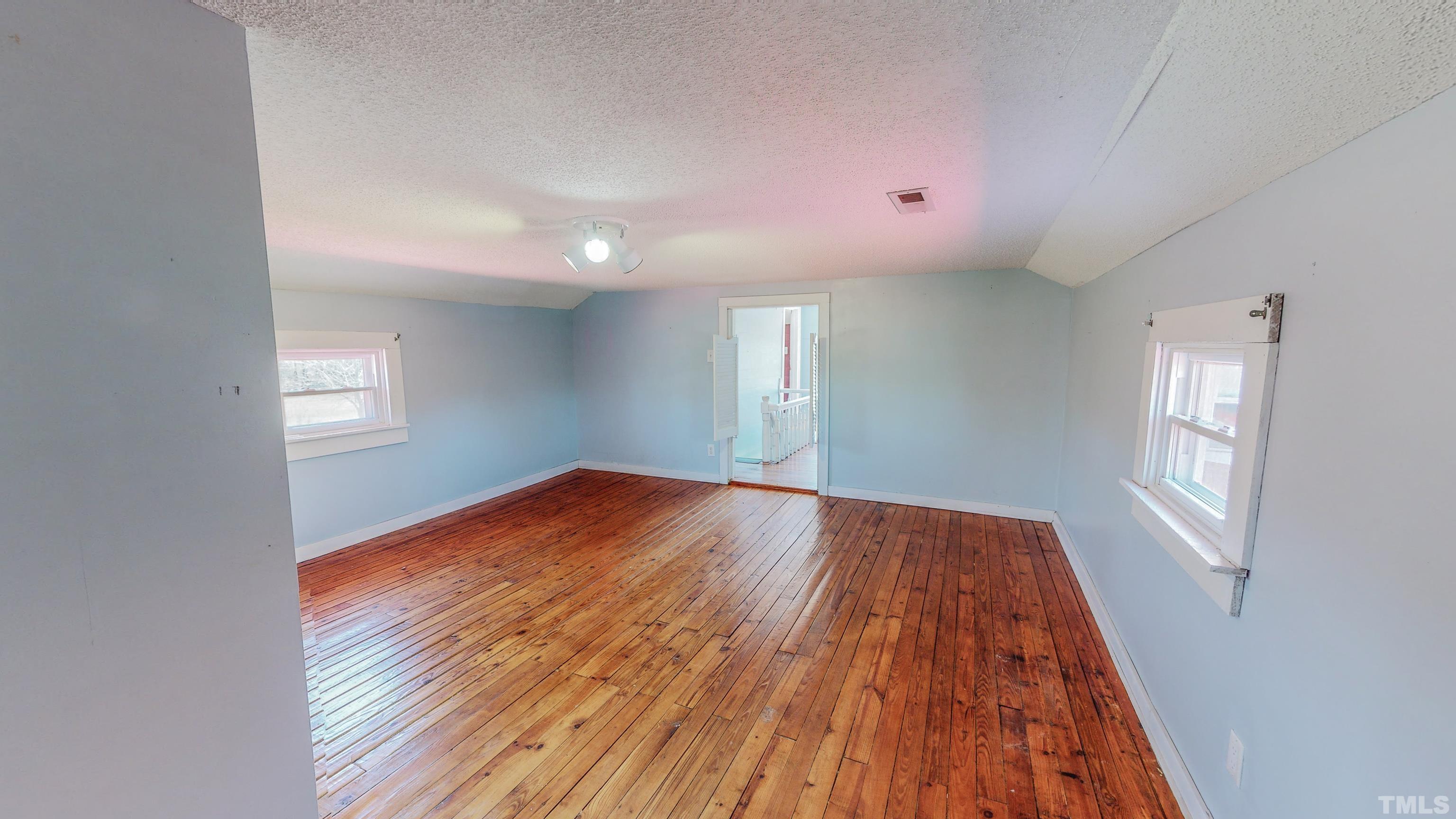 7435 Helena Moriah Road Rougemont, NC 27572 - Photo 38 of 58 wooden floor in an empty room with a window