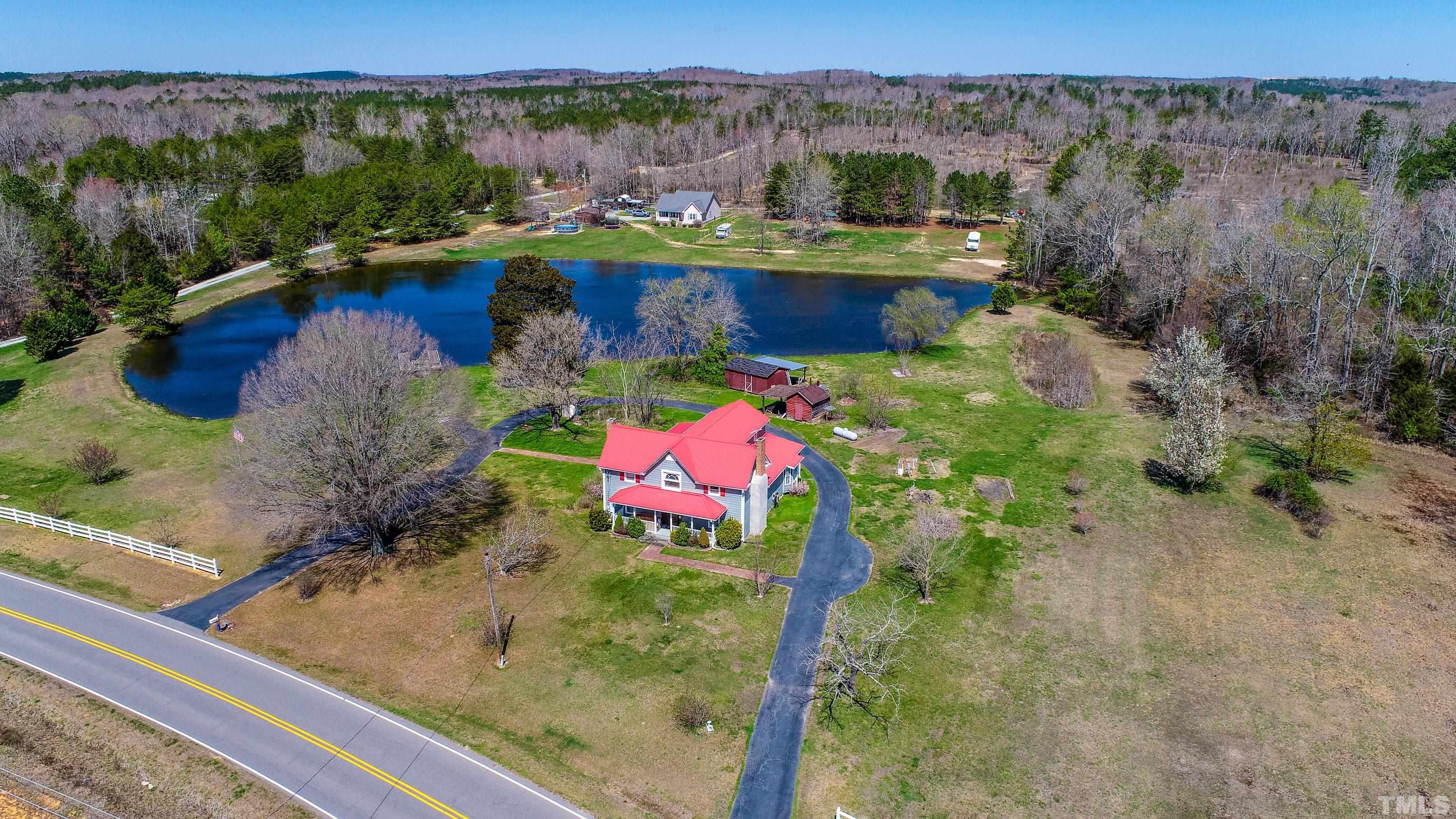 7435 Helena Moriah Road Rougemont, NC 27572 - Photo 53 of 58 a view of a lake with a mountain in the background