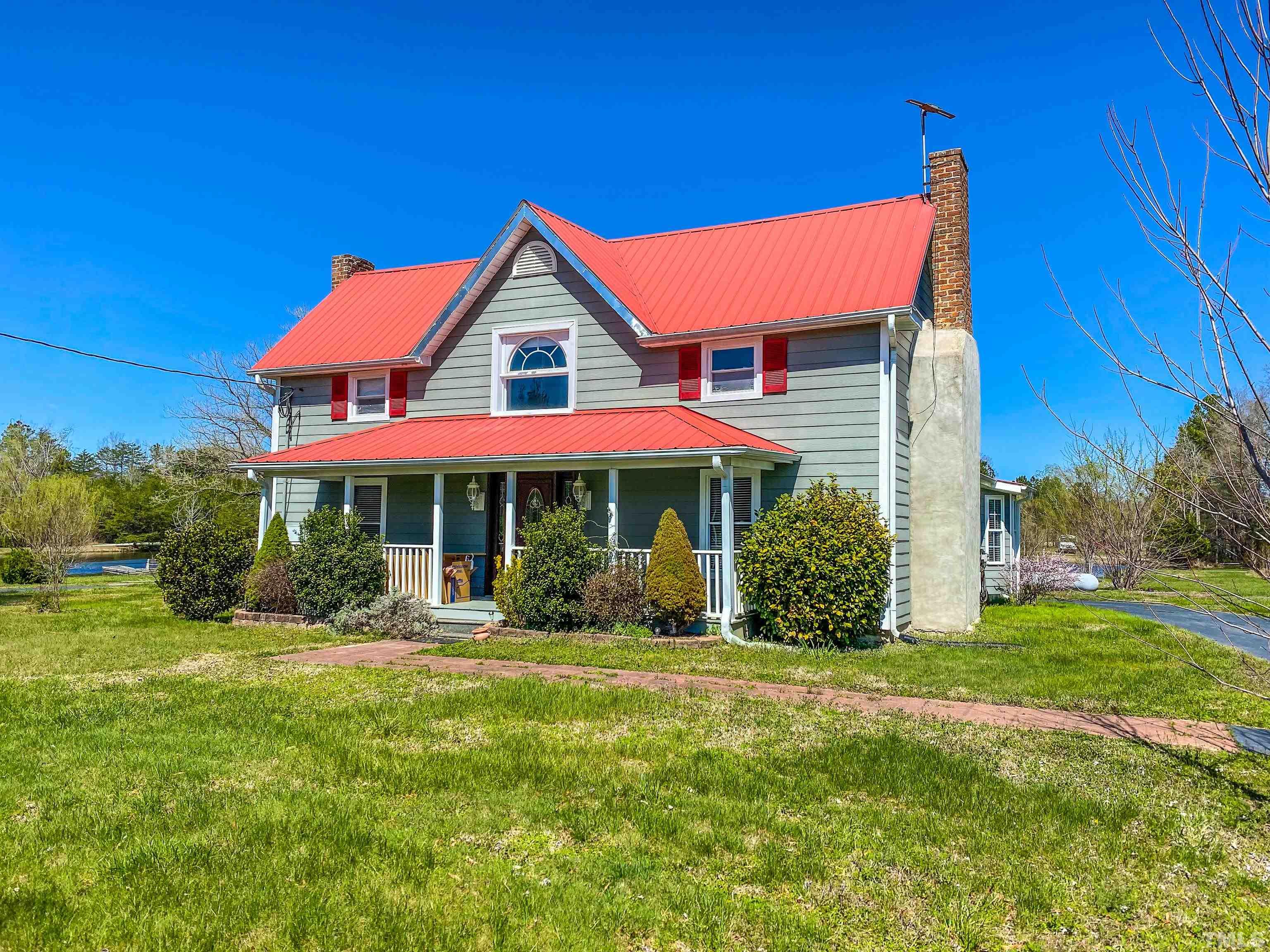 7435 Helena Moriah Road Rougemont, NC 27572 - Photo 55 of 58 a front view of a house with garden