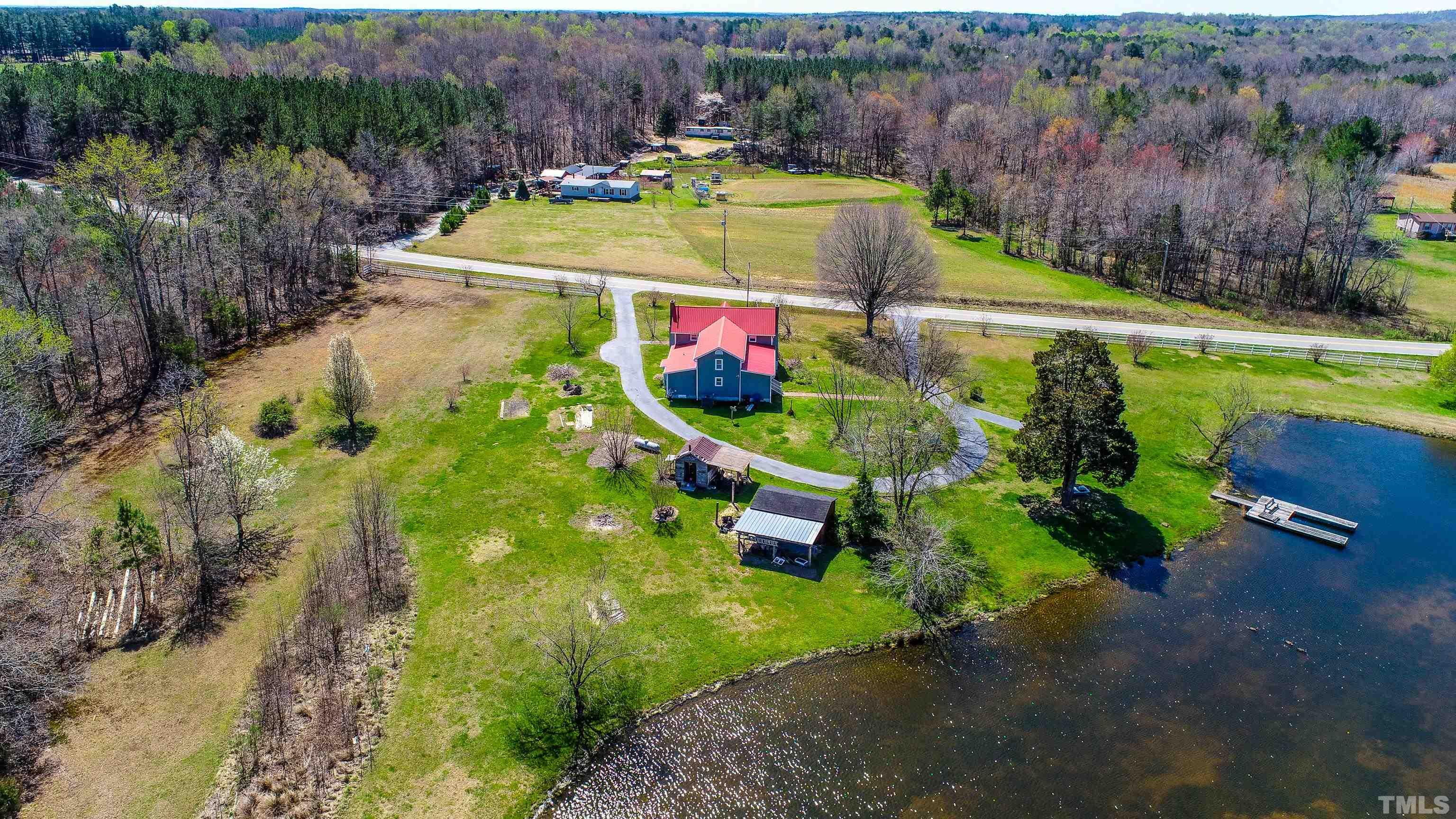 7435 Helena Moriah Road Rougemont, NC 27572 - Photo 9 of 58 an aerial view of a house with a swimming pool