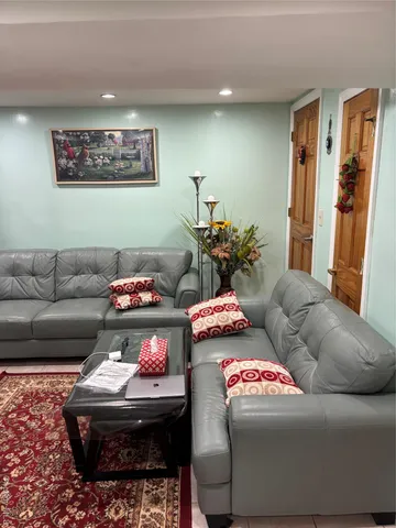 a living room with furniture and a couch