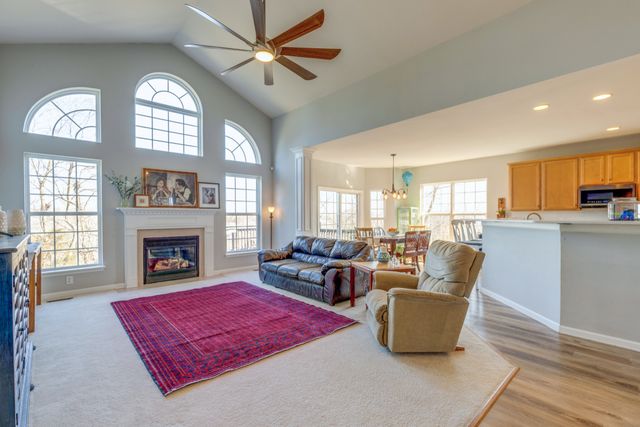 a living room with furniture fireplace and window