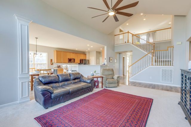 a living room with furniture and a rug