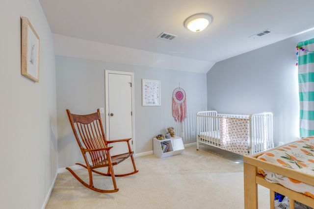 a bedroom with a bed and cabinets