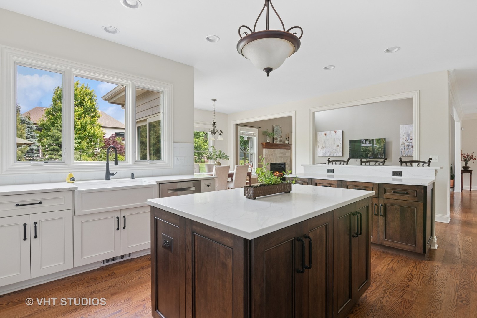 76 Landon Circle Wheaton, IL 60189 - Photo 11 of 51 a kitchen with a sink a center island and cabinets