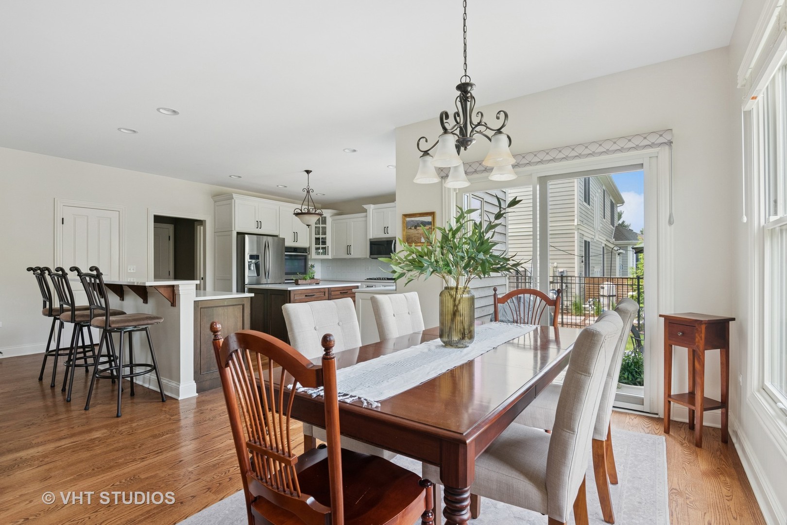 76 Landon Circle Wheaton, IL 60189 - Photo 12 of 51 a view of a dining room with furniture window and wooden floor