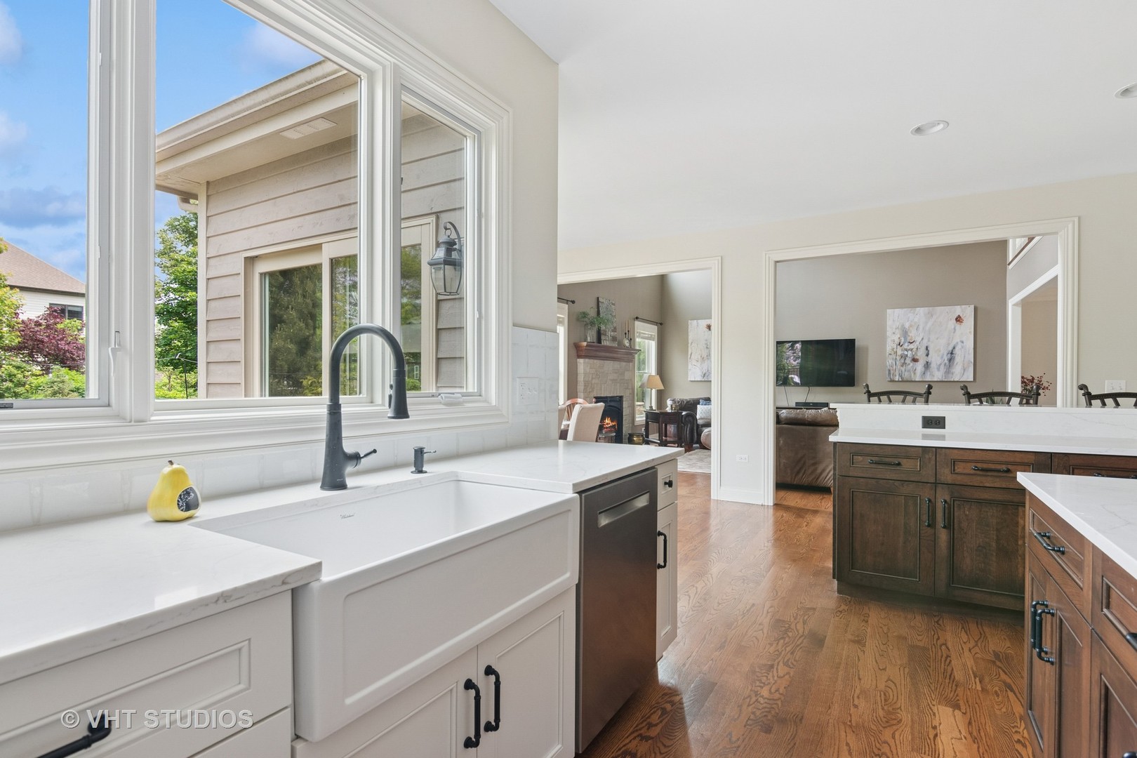 76 Landon Circle Wheaton, IL 60189 - Photo 2 of 51 a large white kitchen with a sink and cabinets