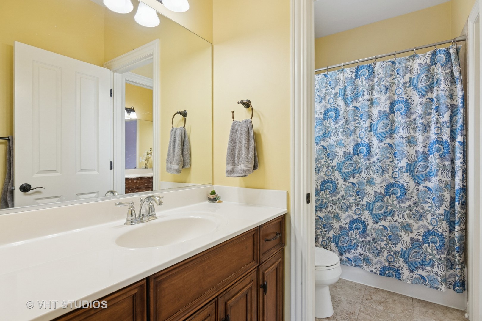 76 Landon Circle Wheaton, IL 60189 - Photo 33 of 51 a bathroom with a sink and a mirror