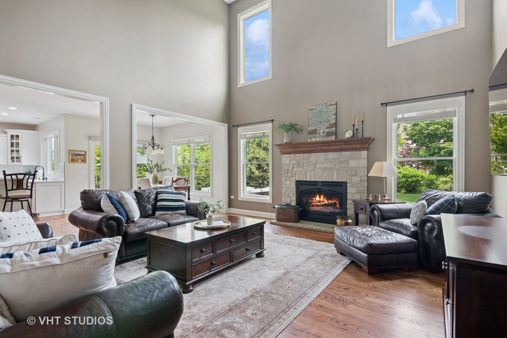 76 Landon Circle Wheaton, IL 60189 - Photo 5 of 51 a living room with furniture large window and a fireplace