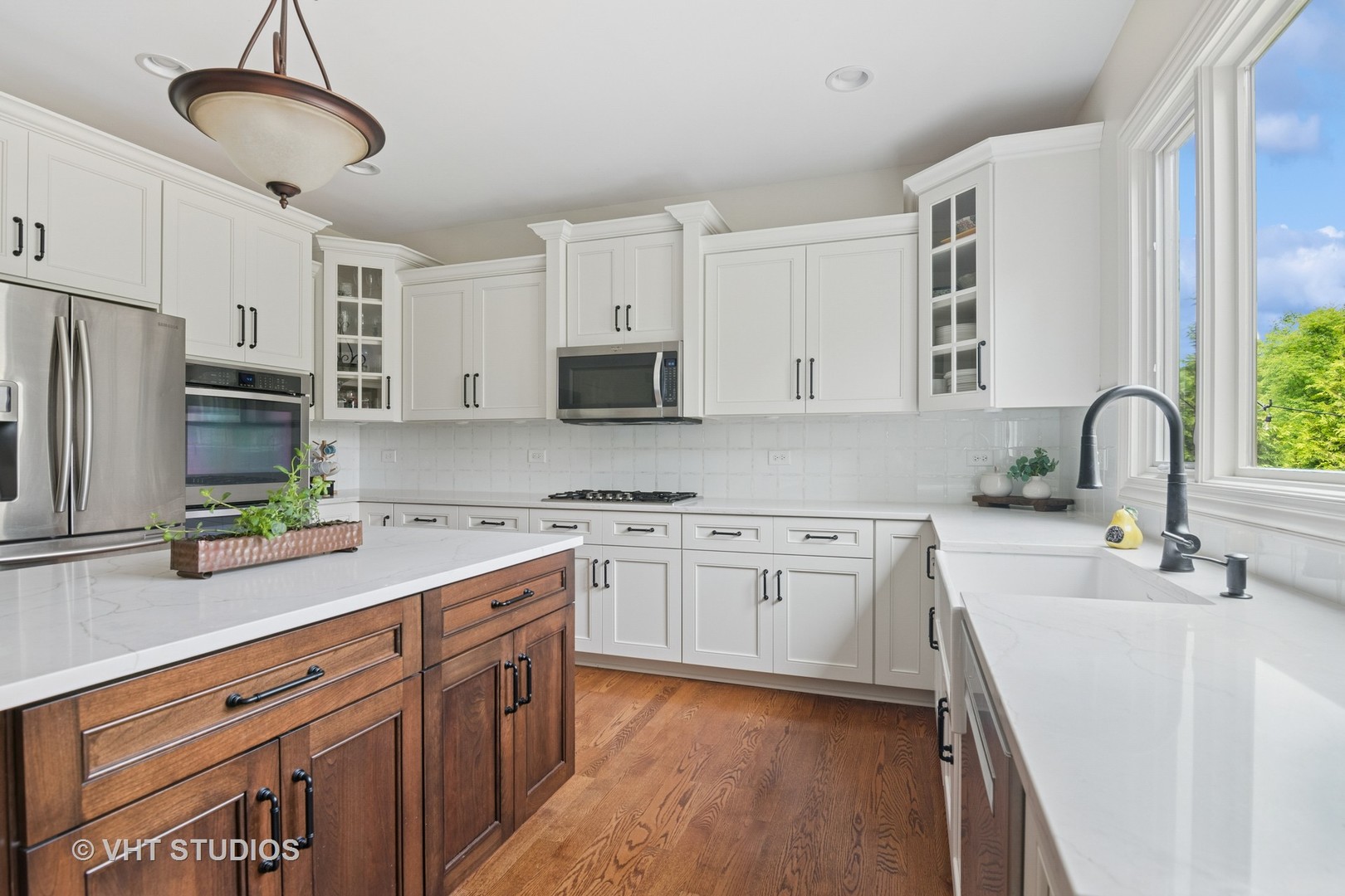 76 Landon Circle Wheaton, IL 60189 - Photo 10 of 51 a kitchen with a sink stainless steel appliances and white cabinets