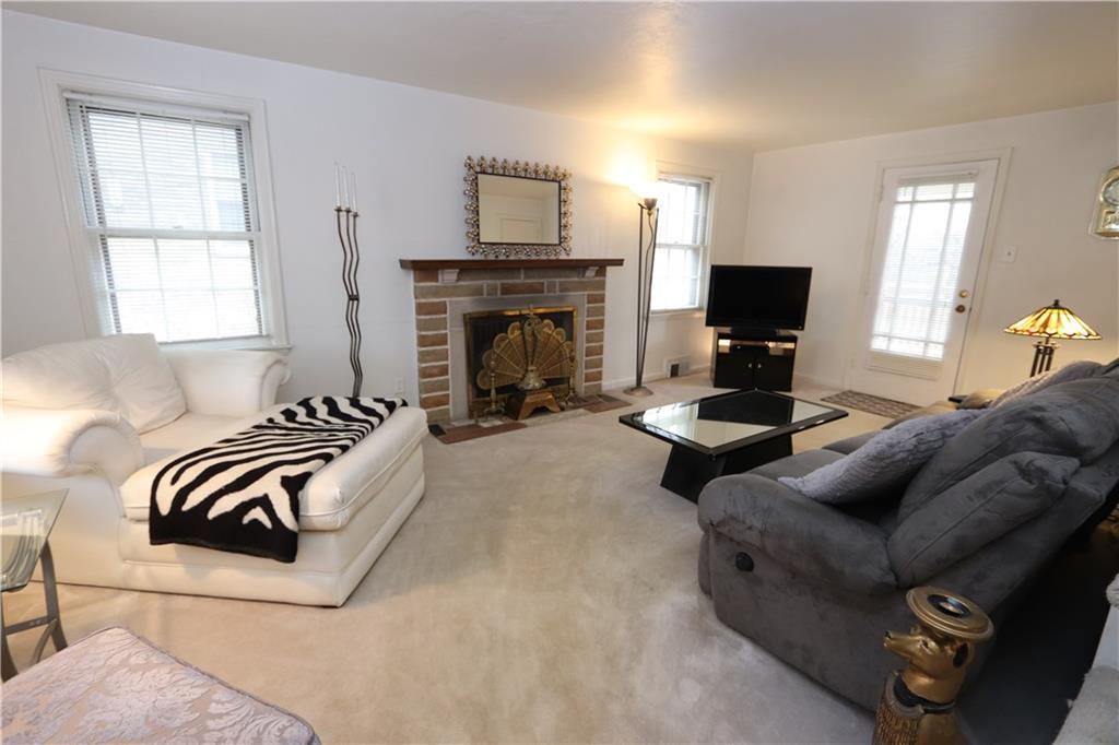 511 Bower Hill Road Pittsburgh, PA 15228 - Photo 3 of 25 Living Room with Stone Fireplace. Door leads to delightful deck.