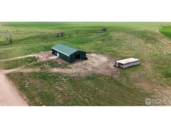 a view of a field with an ocean