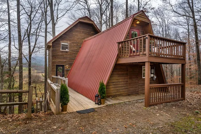 a view of a livingroom with wooden furniture and staircase