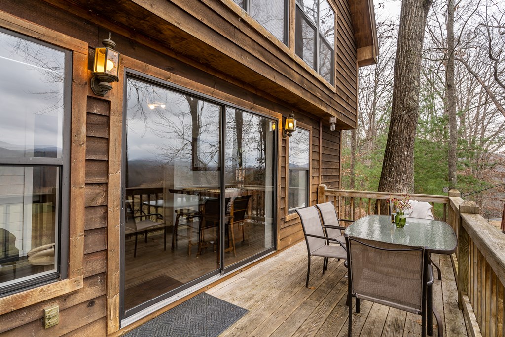 115 Barnhill Road Blairsville, GA 30512 - Photo 14 of 65 a patio with table and chairs