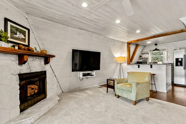 a kitchen with stainless steel appliances granite countertop a sink and a refrigerator