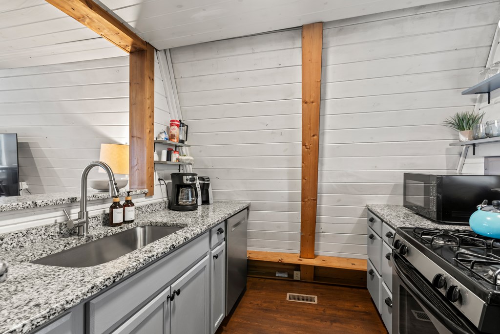 115 Barnhill Road Blairsville, GA 30512 - Photo 24 of 65 a kitchen with a sink and a stove