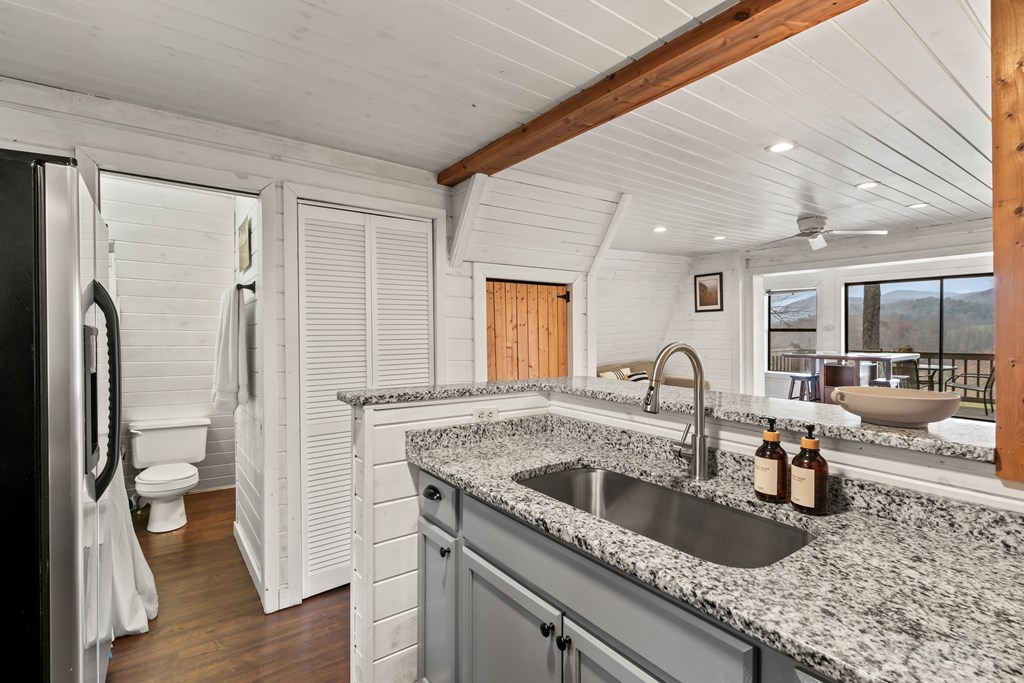 115 Barnhill Road Blairsville, GA 30512 - Photo 27 of 65 a kitchen with a sink and a refrigerator