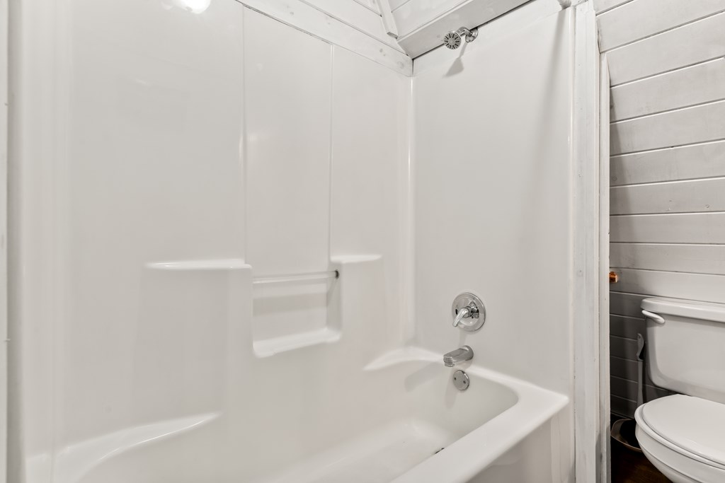 115 Barnhill Road Blairsville, GA 30512 - Photo 28 of 65 a white bath tub sitting next to a white toilet