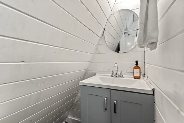 a bathroom with a shower and toilet