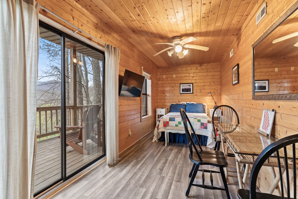 115 Barnhill Road Blairsville, GA 30512 - Photo 42 of 65 a view of a dining room with furniture window and wooden floor