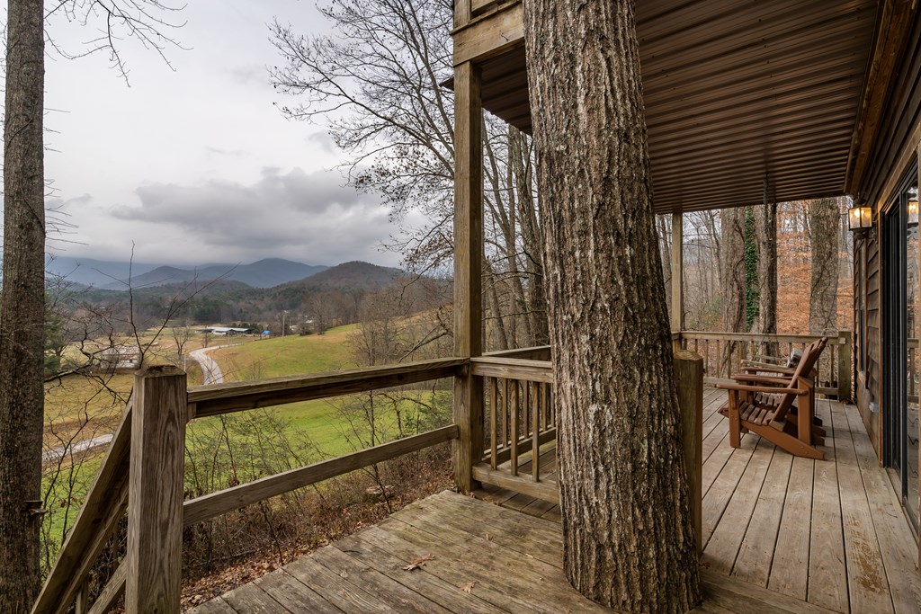 115 Barnhill Road Blairsville, GA 30512 - Photo 43 of 65 a view of a balcony with chairs and wooden floor