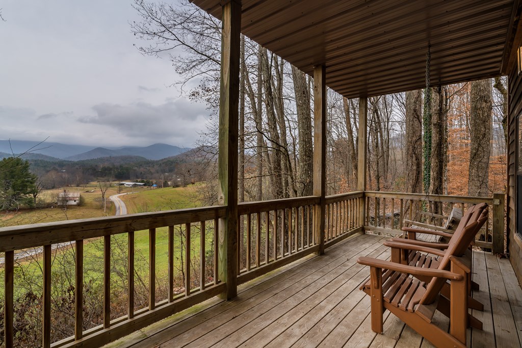 115 Barnhill Road Blairsville, GA 30512 - Photo 44 of 65 a view of balcony with wooden floor and outdoor seating