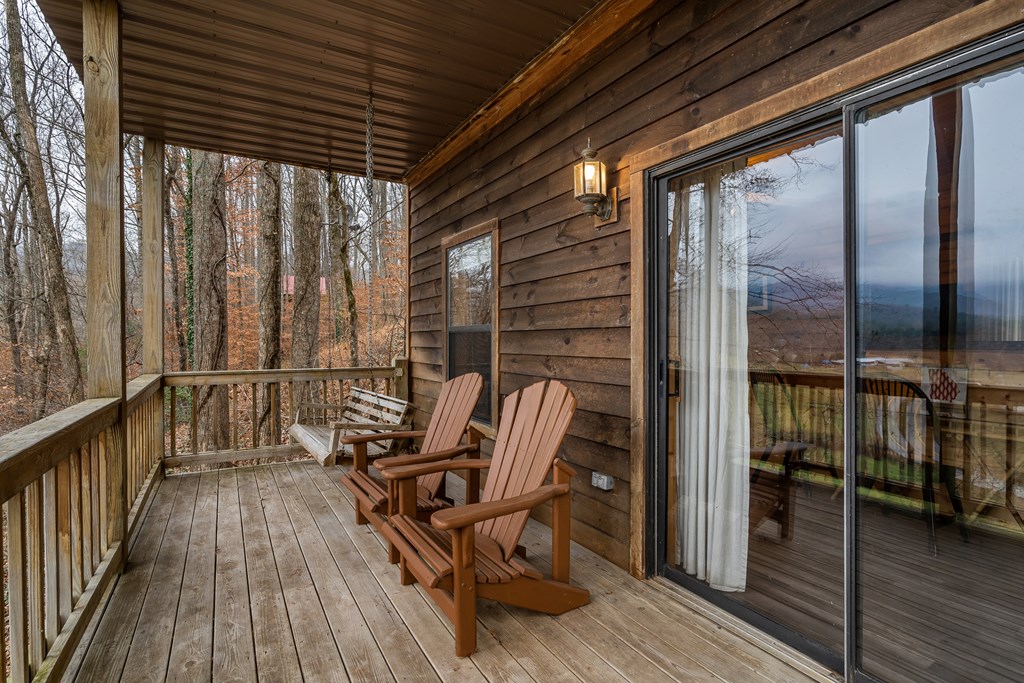 115 Barnhill Road Blairsville, GA 30512 - Photo 45 of 65 a view of balcony with wooden floor and outdoor seating