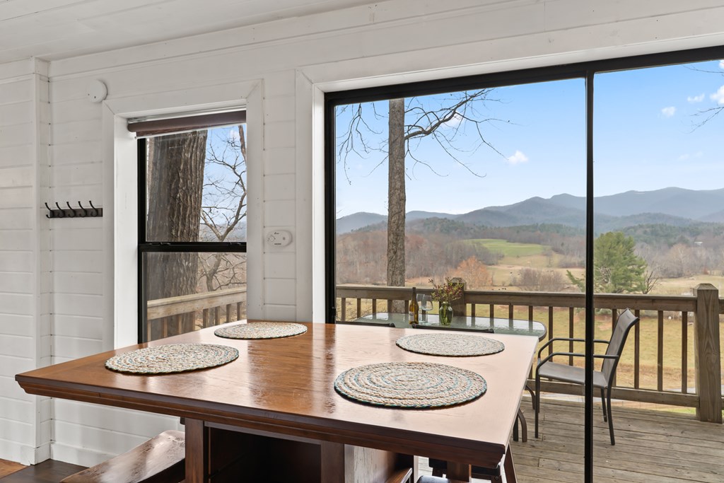 115 Barnhill Road Blairsville, GA 30512 - Photo 5 of 65 a dining room with furniture a large window and a table