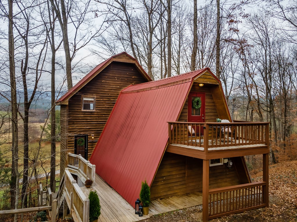 115 Barnhill Road Blairsville, GA 30512 - Photo 55 of 65 a view of a wooden house with large trees