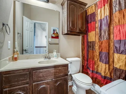 a living room with furniture and a projector screen