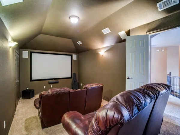 a bedroom with furniture and a ceiling fan