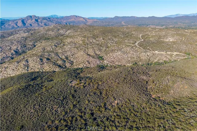 a front view of a house with parking area