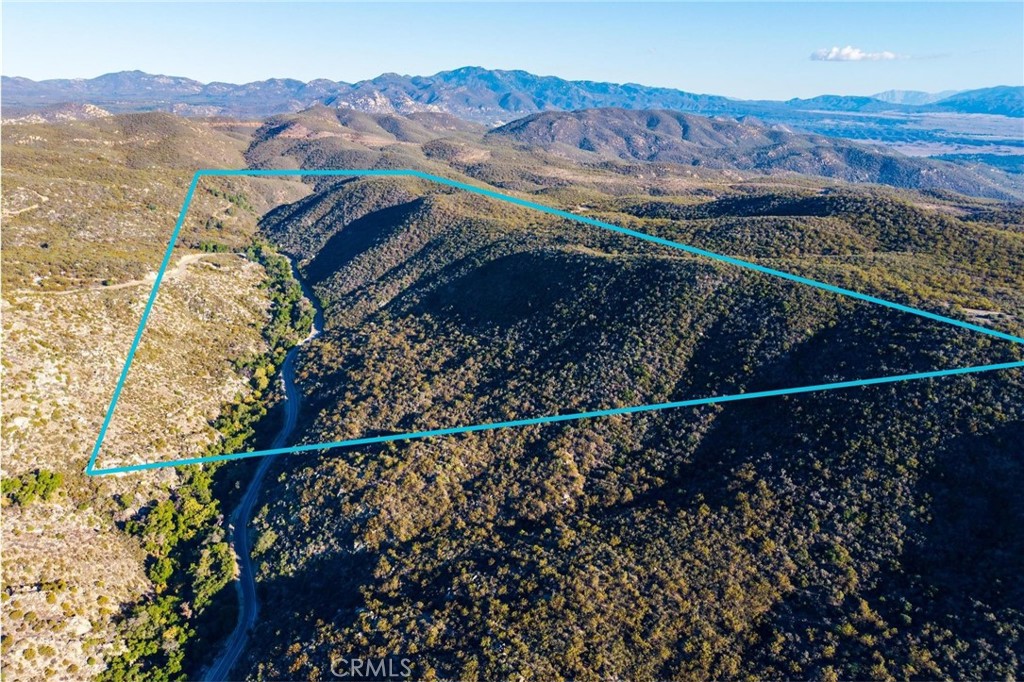 28618 Chihuahua Valley Road Warner Springs, CA 92086 - Photo 27 of 38 a view of a backyard with wooden fence