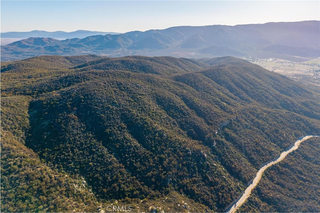28618 Chihuahua Valley Road Warner Springs, CA 92086 - Photo 28 of 38 a view of a lush green hillside and a houses