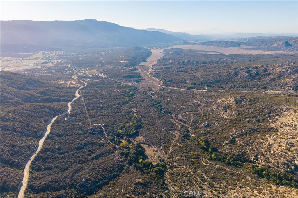 28618 Chihuahua Valley Road Warner Springs, CA 92086 - Photo 30 of 38 a view of a dry yard with mountains in the background
