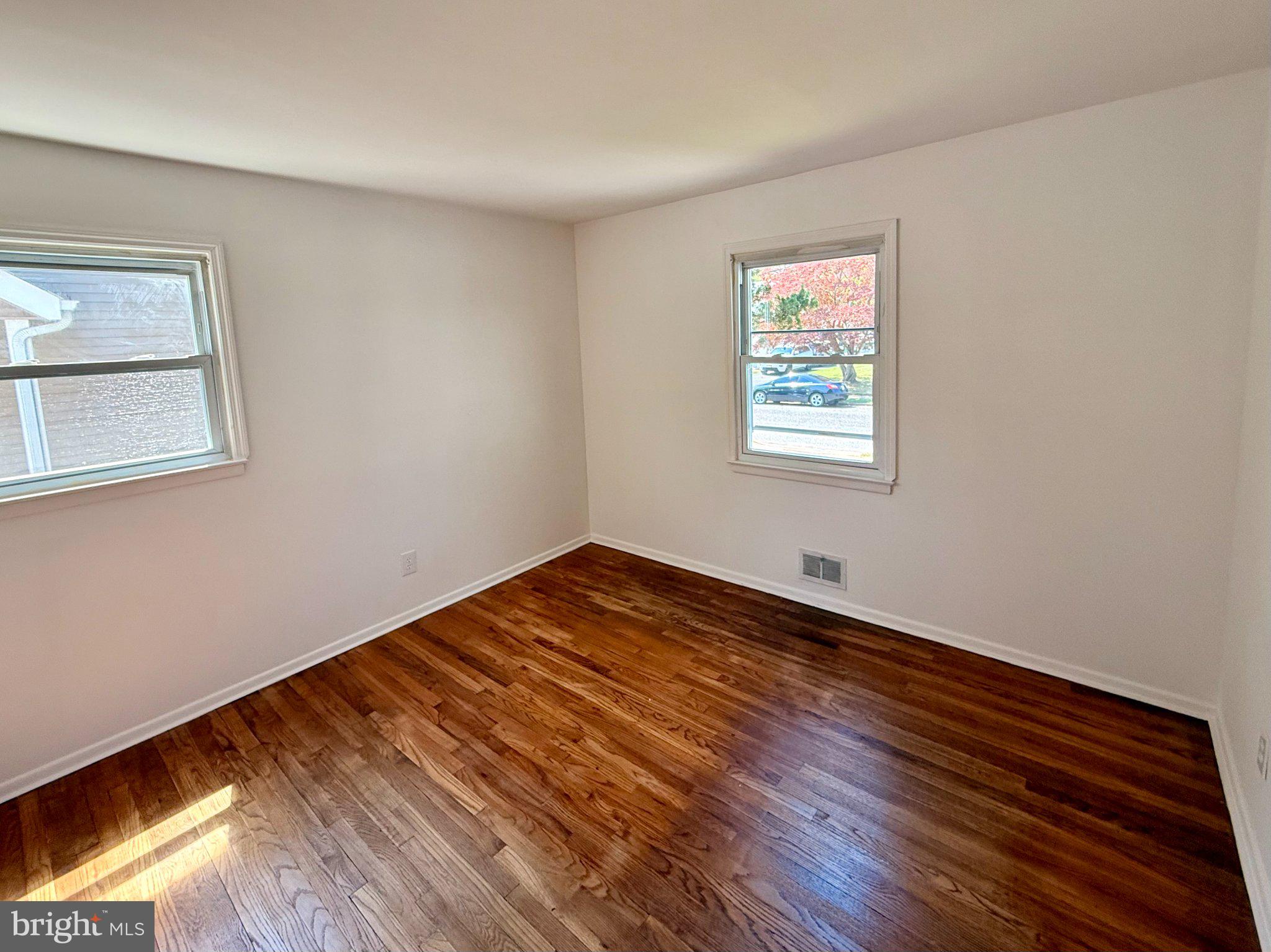 4 Llewellyn Place Hamilton, NJ 08620 - Photo 6 of 14 Bright and airy room with hardwood floors.