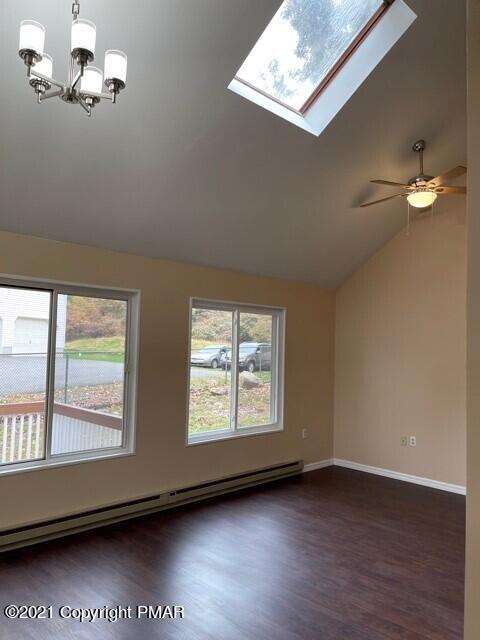 2115 Bushkill Circle Bushkill, PA 18324 - Photo 18 of 42 an empty room with wooden floor and windows