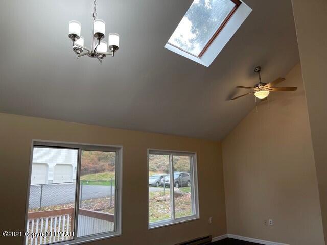 2115 Bushkill Circle Bushkill, PA 18324 - Photo 21 of 42 a view of a livingroom with a chandelier fan and windows