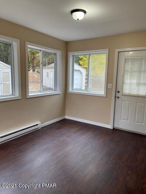 2115 Bushkill Circle Bushkill, PA 18324 - Photo 22 of 42 an empty room with wooden floor and windows