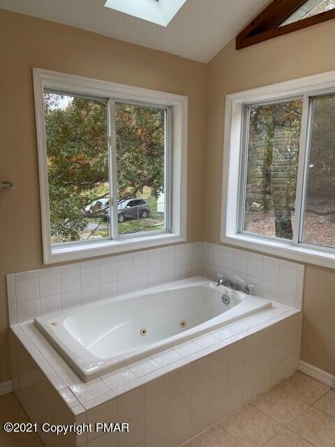 2115 Bushkill Circle Bushkill, PA 18324 - Photo 30 of 42 a white bath tub sitting in a bathroom next to a window