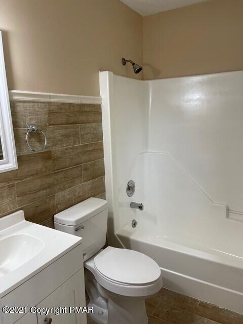2115 Bushkill Circle Bushkill, PA 18324 - Photo 36 of 42 a bathroom with a toilet a sink and bathtub