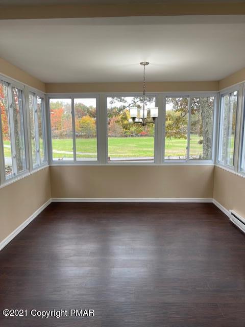 2115 Bushkill Circle Bushkill, PA 18324 - Photo 10 of 42 an empty room with wooden floor and windows