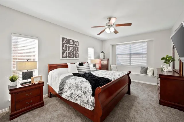 a bed room with a bed and a window