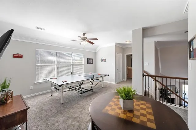 a living room with furniture windows and wooden floor