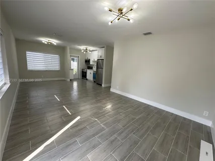 a view of livingroom with hardwood floor and ceiling fan