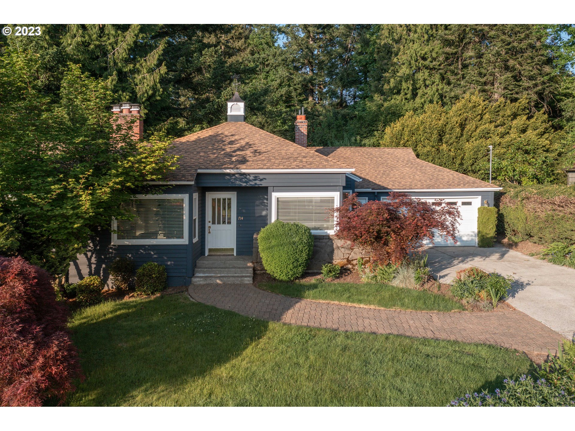 714 Northwest Skyline Crest Road Portland, OR 97229 - Photo 42 of 47 a aerial view of a house with a yard potted plants and large tree