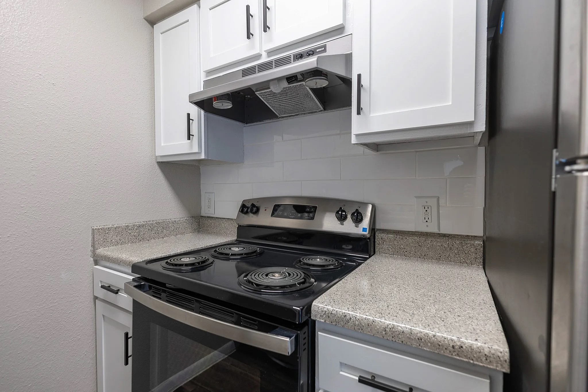 15100 Golden Eagle Drive, Unit 1305 Humble, TX 77396 - Photo 21 of 22 a kitchen with a stove and a microwave